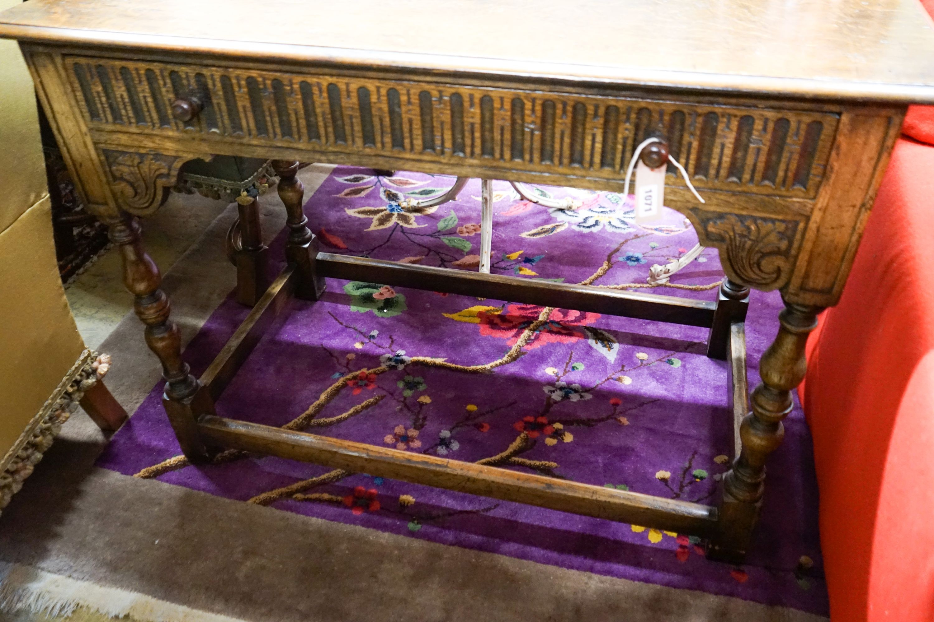 A 17th century style carved oak side table, width 107cm, depth 56cm, height 76cm